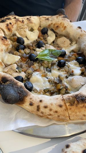 Caponata with vegan rice cheese, smoked cashew cream, eggplant, olives, courgette and parsley.   at Tozzi Forneria Moderna in Lisbon