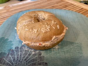 Sesame bagel with sun dried tomato and roasted garlic cream cheese  at Hark! Cafe in Plymouth