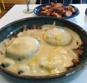 Biscuits and sausage gravy, side of potatoes   at Hark! Cafe in Plymouth