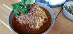 Charred cabbage, kolae coconut curry at alter in East London