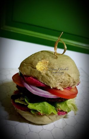 Vegan Delights Veggie Burger: In House freshly Baked Herbed Bun  with Black and white sesame seeds.

Filled with Ghawdess Hummus, Fresh Spring mix, premium veggie burger, red onion at Eleven Oh 7 in Saint Michael