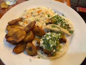 Vegan tacos al pastor with rice and fried plantains  at Salsa A La Salsa in Minneapolis