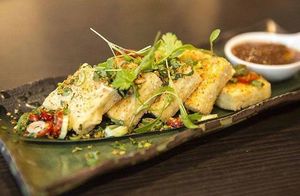 Deep fried tofu served with peanut sauce at The Mango Tree in London