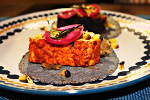 Smoked tempeh tacos with BBQ haricot beans, garnished with jalapeño ash salsa and spring onions at Bang Kitchen in East London