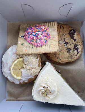 Raspberry poptart, sea salt chocolate chip cookie, lemon brioche donut, and lemon cake.   at Just What I Kneaded in Los Angeles