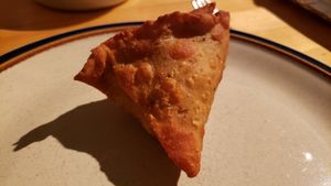 Samosa ($5). Charred flavor, plus unwanted sweetness from carrots & corn. at Curry In A Hurry in Minneapolis