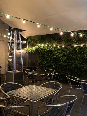 Outdoor dining at night  at Green Island Bistro in Rhuddlan