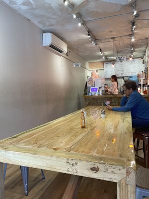 Large communal table  at Forever Coffee NYC in New York City
