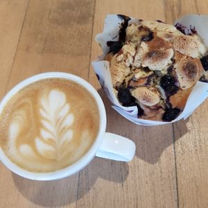 Oat latte & vegan blueberry white choc muffin.  at A Good Little Thing in Tootgarook