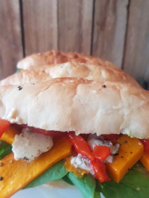 Pumpkin turkish bread with spinach, hommus, avo, red capsicum & Feta.feom The Vegan Dairy at A Good Little Thing in Tootgarook