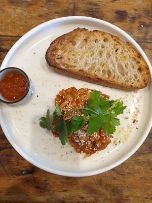 Housemade baked beans w/harissa (instead of Tzatziki to make it vegan), + sourdough at Advieh in Seddon