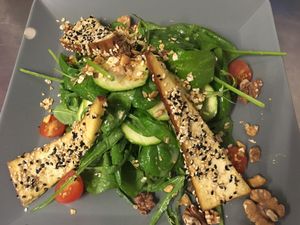 Spinach salad with smoked tofu slices at Viasko - Bar und Restaurant in Berlin
