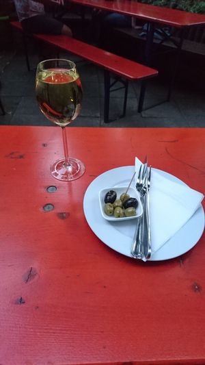 Riesling and olive snack  at Viasko - Bar und Restaurant in Berlin
