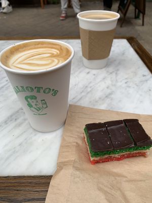 Oat milk latte and rainbow cookies  at Galioto's Delicatessen in New York City