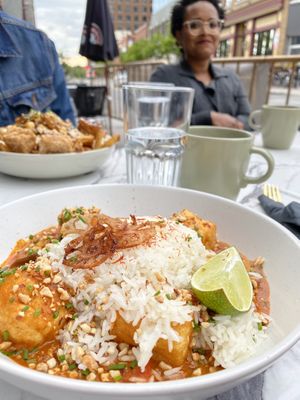 General Tao poutine in back, red curry in front at Astoria Bistro Botanique in Gatineau