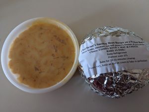 Combo. Chef Dylan's delicious smokey bean burger on a pretzel bun, with a side of tasty creamy mac and cheese at Sinfull Bakery in Houston