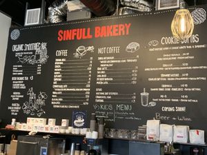 Large menu for drinks  at Sinfull Bakery in Houston