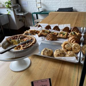 Quiche and some yummy looking cheezy things on the lower right  at Le Petit Monstre in Brooklyn