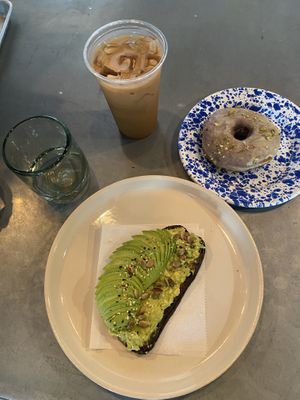 Avocado toast, pistachio donut and iced coffee   at Le Petit Monstre in Brooklyn