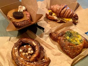 Caramel cronut, breakfast sandwich, cheese danish, and hazelnut snail at Le Petit Monstre in Brooklyn