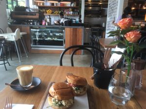 Plant based sliders, scramble, bacon, spinach, soft brioche buns, SCRUMPTIOUS plus delish oat latte  at The Old Garage in Camberwell