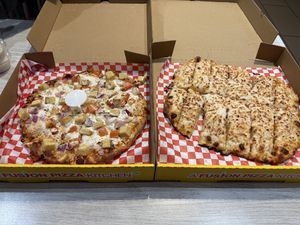 Butter chicken pizza and cheesy bread   at Pizza Twist in Sacramento