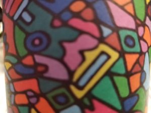 Had to undo my coffee cup's artwork to take home with me! So funky. at Kafe Kweer in Edinburgh