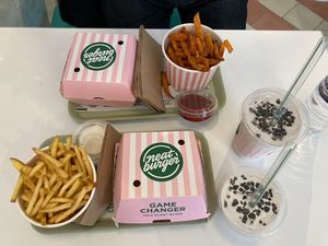 Two chick n avo burgers, fries, sweet potato fries and two Oreo shakes at Neat - Soho in London