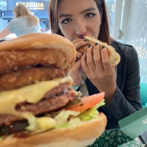 Burger shot with a hot dog eater behind at Neat - Soho in London