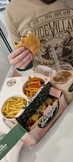 Hot dog, cheeseburger, fries, and sweet potato fries at Neat - Soho in London