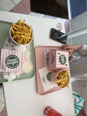 two burgers, cheesy chips and chips  at Neat - Soho in London