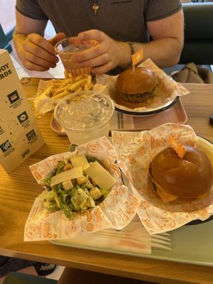 Chicken burger, fries and watermelon lemonade (far tray)   at Neat - Soho in London