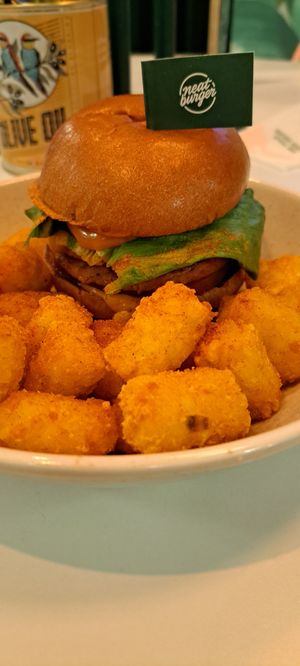 Neat burger with spicy tater tots at Neat - Soho in London