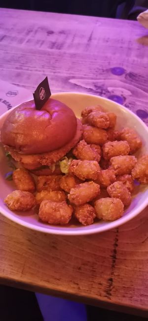 "Chicken" burger and tater tots at Neat - Soho in London