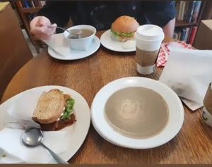 Creamy mushroom soup, parsnip sandwich (bottom left) and southern fried tofu Sandwich (top) at Thyme Cafe and Bookstore in Winnipeg