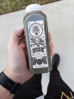 Lucky 13 - cold brew & oatmilk latte made with activated charcoal and lavender sweetened with agave at Black Willow Cafe in Beaumont