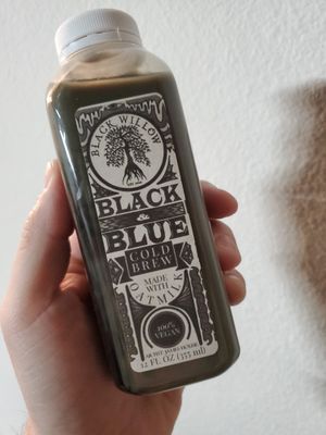 Black & Blue - cold brew & oatmilk latte made with activated charcoal and blueberry sweetened with agave at Black Willow Cafe in Beaumont