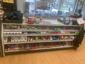 Front counter section full of vegan chocolate, energy bars, gum, energy/sleep supplements & fruit strips at George Street Co-op & Cafe in New Brunswick