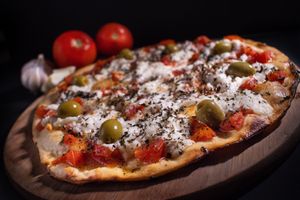 Every pizza of our menu can be made with gluten free flour. This is our Margot pizza: Our version of the classic Margarita. Tomato sauce, garlic, basil + veggie cottage cheese at Layla Restaurant Plants & Mushrooms in Puerto Morelos