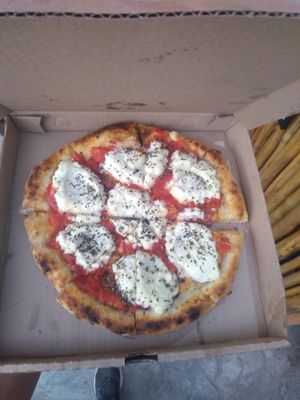 Pizza margarita  muy rica Munchies! at Layla Restaurant Plants & Mushrooms in Puerto Morelos