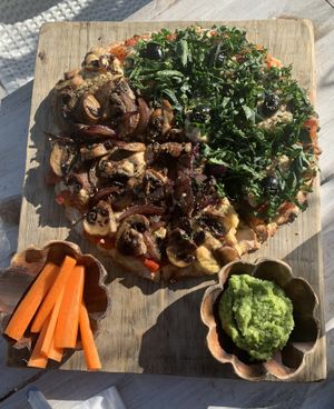 Half Mushroom, Half Cashew Cream, Gluten Free Crust! Absolutely incredible! Best pizza I have EVER had! Great service from a sweet couple from Argentina who run the spot! A GEM!!! at Layla Restaurant Plants & Mushrooms in Puerto Morelos