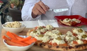 Margarita Pizza with hummus on the side at Layla Restaurant Plants & Mushrooms in Puerto Morelos