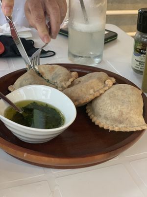 Empanadas with chimichurri  at Layla Restaurant Plants & Mushrooms in Puerto Morelos