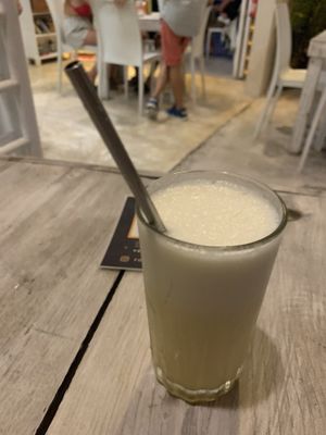 Coco loco (coconut water mixed with pineapple) at Layla Restaurant Plants & Mushrooms in Puerto Morelos