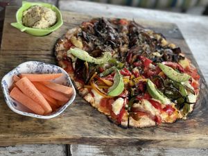 Half half pizza, mushrooms and I forgot the other one  at Layla Restaurant Plants & Mushrooms in Puerto Morelos