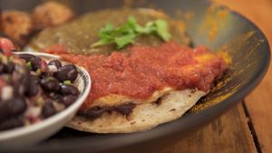 "Huevos" divorciados. Servidos sobre tortillas de quinoa! at Layla Restaurant Plants & Mushrooms in Puerto Morelos