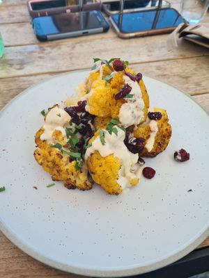 Roast cauliflower florets with eggplant and saffron jam, cranberry and zesty parsley tahini at Hotel Rottnest in Rottnest Island