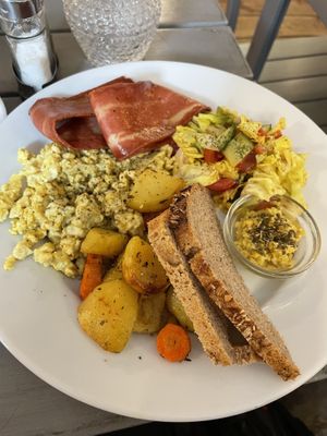Scrambled tofu, vegan bacon, toasts and vegetables   at Radikalecker in Berlin