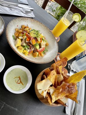 Vegan ceviche, mango juices and yuca and sweet potato chips.  at Lima Cocina Peruana in Rio De Janeiro
