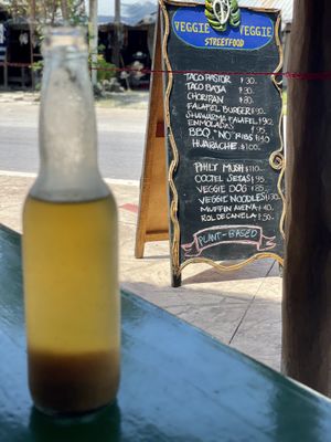 Home brewed kambucha and menu in the back at Veggie Veggie in Puerto Morelos